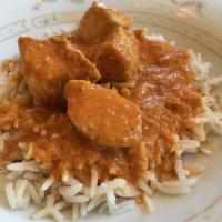 Chicken Korma · Chicken breast pieces simmered in silky spiced sauce with cream. Served with basmati rice, s...