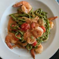 Pasta Verde · Homemade spinach noodles, jumbo shrimp, tomatoes, charred Brussels sprouts, onions and basil...