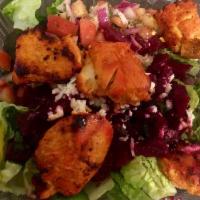 Greek Salad · Romaine, mixed greens, red cabbage, carrot, cucumber, tomato, feta, Kalamata olives, grape l...