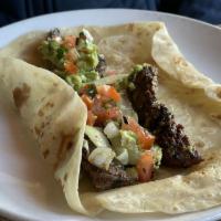 Beef Fajitas Poblano · Topped with sliced poblano peppers, field mushrooms, and melted Monterey jack cheese.  Serve...