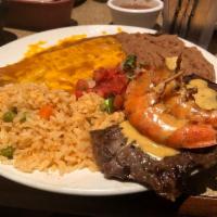Cowboy Steak · 6 oz grilled certified Angus beef outside skirt topped with two jumbo chipotle shrimp.  Serv...
