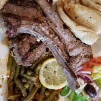 Lamb Chops Platter · 3 lamb chops marinated in lemon juice with select seasoning served over rice and vegetables....