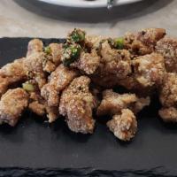 Soy Garlic Chicken · Tossed in soy garlic sauce with scallions and sesame.