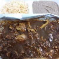 Chicken Guatemalan Pipian · A delicious dark red Guatemalan mole sauce, made from roasted tomatoes, roasted peppers, ses...