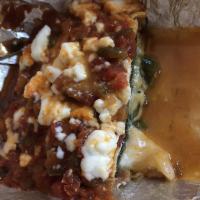 Chile Relleno · A roasted poblano pepper stuffed with cheese and egg wrapped and simmered in a delicious med...