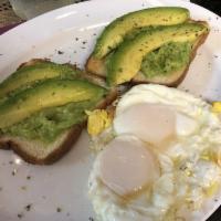 Avocado Toast · Whole grain toast, topped with fresh smashed avocado, and lemon. Served with 2 fried eggs.