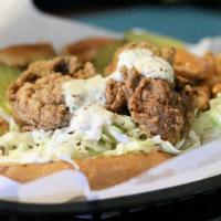 Fried Oyster Po Boy · Served with homemade tartar sauce. Shredded cabbage, tomato, pickles, mayo, Creole mustard o...