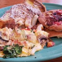 Sundeck Combo D · Two chocolate chip banana pancakes, one strawberry banana crepe, veggie omelet and fruit sal...