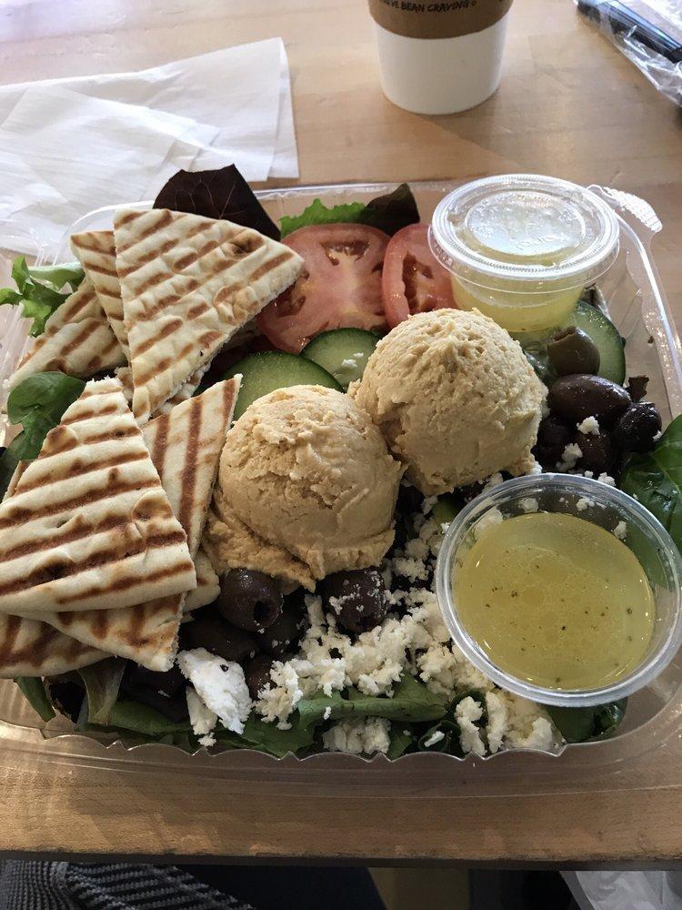 Hummus Plate · Our homemade hummus served with sliced tomatoes, and mixed greens, cucumber, feta, and olives tossed in our balsamic vinaigrette and with warm pita bread.