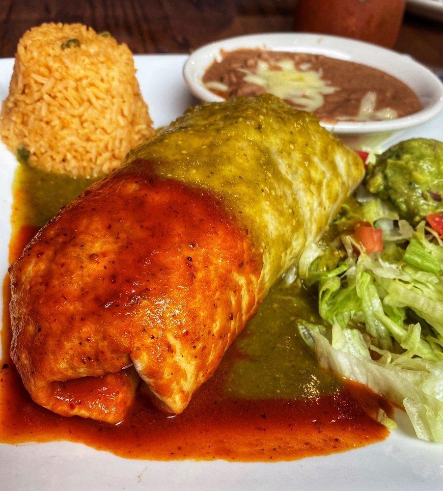 Carnitas · 10 oz. seasoned pork sliced into chunks & slow-cooked. presented with lettuce, tomatoes, rice, beans, tomatillo sauce and your choice of corn or flour tortillas.
