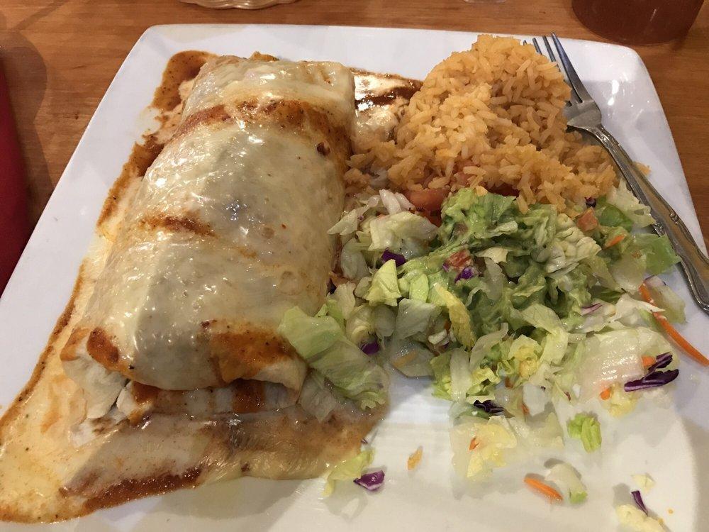 Fajita Burrito · Large flour tortilla filled with sauteed mushrooms, bell peppers, onions, broccoli, cauliflower, smothered in red enchilada sauce then topped with cheese sauce. Served with pico de gallo and guacamole salad.