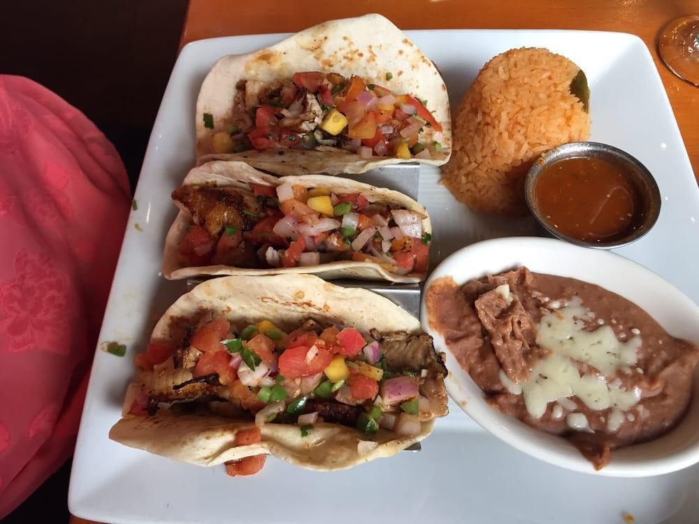 Fish Tacos · 3 fish tacos with spicy pico de gallo and a side of salsa. Served with rice and beans.