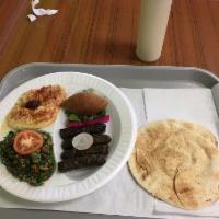 Mixed Plate · Fried kibbe, grape leaves, hummus, baba ghanouj, tabouleh, served with pita bread.