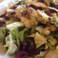 Mediterranean Salad · Mixed greens tossed with lemon tahini dressing, chickpeas, artichokes, tomatoes, cucumbers, ...