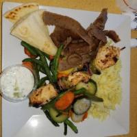 Mix and Match Plate · A choice of 2 proteins served with a Greek side salad, seasoned basmati rice, choice of humm...