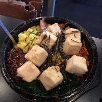 Bibimbap · White rice, quinoa, assorted seasonal vegetables and egg with Bonchon red pepper paste on th...