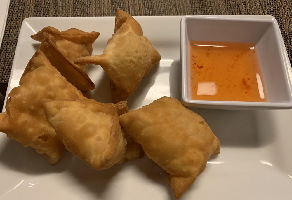 Crab Rangoon · 5 pieces. Thin wonton skin wrapper stuffed with minced crab meat, cream cheese, scallion and onion then deep fried to a crispy golden brown. Served with sweet and sour sauce.