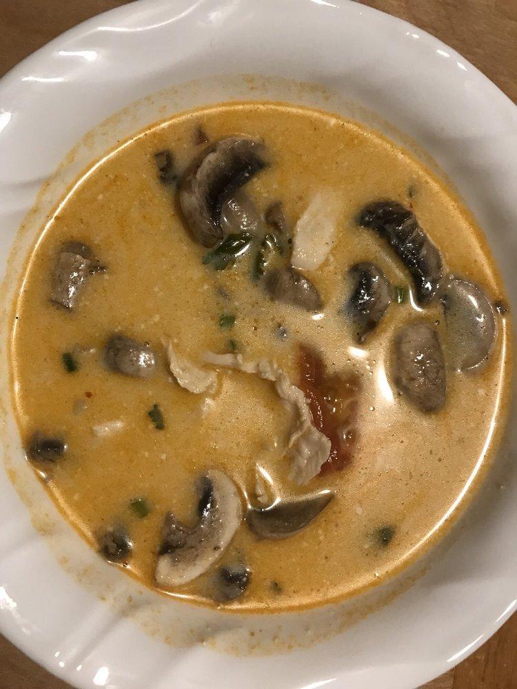 Tom Kha Soup · Traditional Thai style seasoned chicken in a soft creamy soup flavored with coconut milk, lemongrass, galangal, lime juice, mushroom, cilantro and scallion.