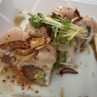 Garlic Albacore Roll · Inside: spicy tuna, avocado, cumber. Outside: albacore, fried garlic with soy mustard
