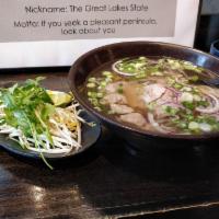 Deluxe Pho · Beef, meatballs and tripe. Rice noodle with choice of meat in aromatic beef bone soup. Serve...