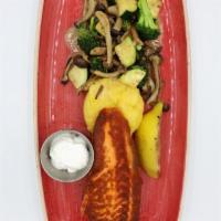 Grilled Salmon · Served with yellow squash, zucchini, Shimeji mushrooms, broccoli florets, Mamaliga (Moldavia...