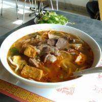 Bun Bo Hue · Hot and spicy rice noodle soup with beef brisket and pork hock.