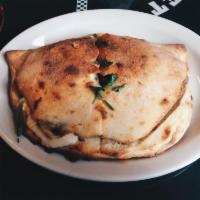 Calzone · Filled with mozzarella, Parmesan, ricotta cheese and choice of 2 pizza toppings.