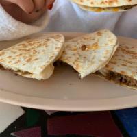 Quesadilla · Flour tortilla lightly grilled and filled with jack cheese.
