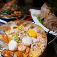Tom Yum Noodle Soup · With scallion, chili, lemongrass, galanga, lime leaf in spicy tom yum broth top with egg. Ho...
