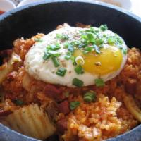 Kimchee Fried Rice · Kimchee, ham and vegetable mix served in a hot stone bowl with fried egg.