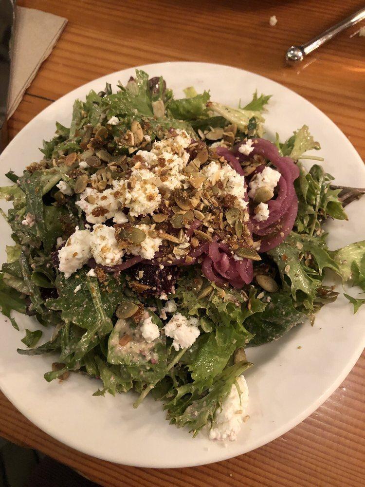 Beet Salad · Baby greens, beets, house pumpkin brittle, pickled onions, goat cheese, house walnut vinaigrette.