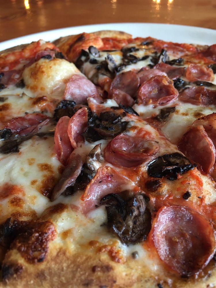 Classico Pizza · Organic pizza dough, organic tomato sauce, fresh mozzarella, smoked provolone, Alaska fennel sausage, Alaska soppressata salami, mushrooms, and red bell peppers.