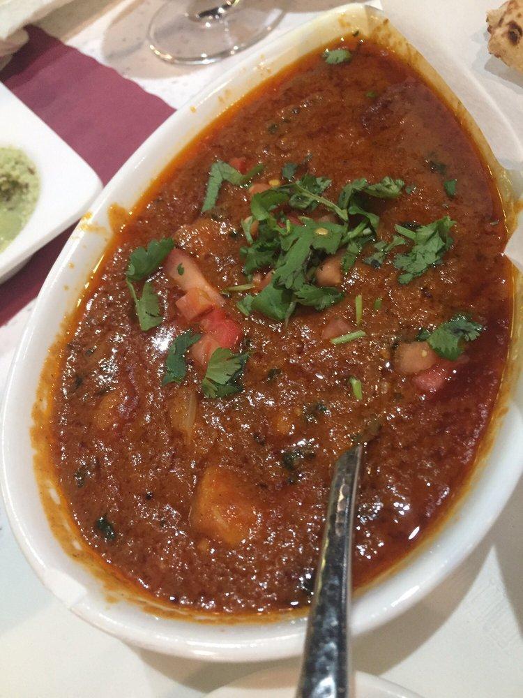 Tikka Masala · Chicken, goat or shrimp baked in clay oven in spicy sauce with bell peppers and onions.