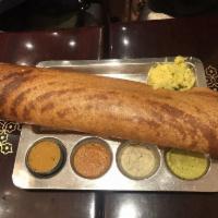 Masala Dosa · Thin rice and lentil crepe filled with spiced mashed potatoes and onions.