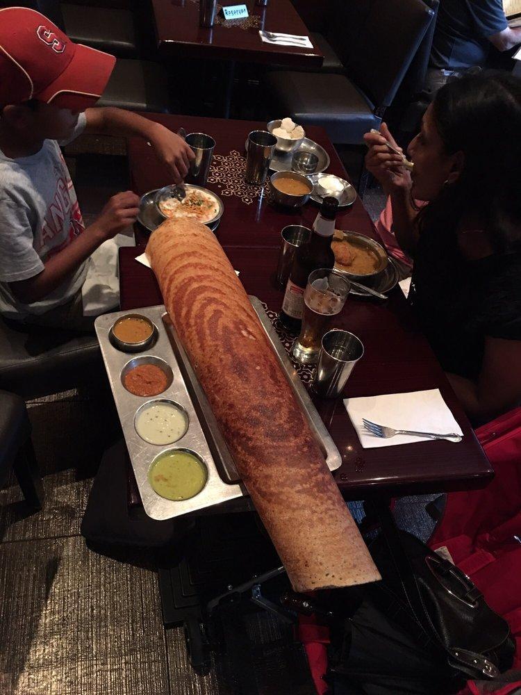 Paper Masala Dosa · Thin, lengthy rice and lentil crepe filled with mildly spiced mashed potatoes and onions.