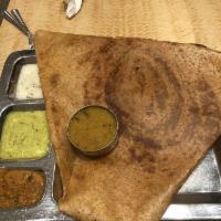 Onion Dosa · Thin rice and lentil crepe topped with onions.