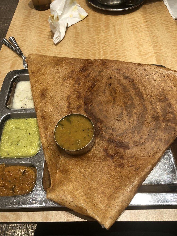 Onion Dosa · Thin rice and lentil crepe topped with onions.