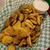 Pickle Chips · Hand-breaded and deep-fried pickle chips. Served with ranch dressing.