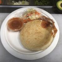 Pupusas · Served with cabbage curtido and red sauce.