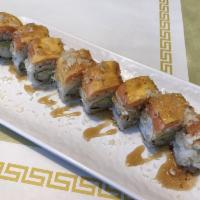 Arata Roll · Shrimp tempura inside, soft shell crab mix, salmon and mango outside.