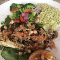 Hawaiian Sand Fish · Lightly sauteed and served over a bed of spinach with shrimp and field mushrooms in a light ...