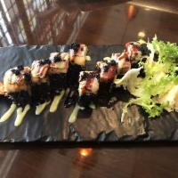 Mafia Roll · Wrapped with black roll. In: lobster tempura and avocado. Out: lobster salad, seared peppere...