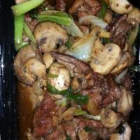Black Pepper Beef Dinner · Beef, mushrooms, onion with sweet black pepper sauce. Served with your choice of rice on the...
