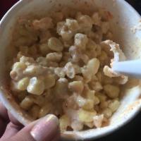 Esquite · Corn in a cup with lime, mayo, butter cheese, and Chile.