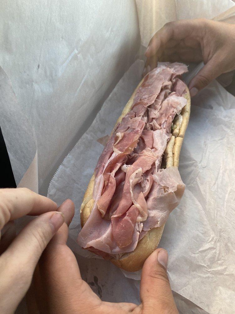 Italian Hoagie · Capicola ham, Genoa salami, imported ham and provolone cheese. Authentic New Jersey bread stuffed with Boar's Head meat and cheese. Includes lettuce, tomatoes, onions, Italian seasoning and oil. Served cold.