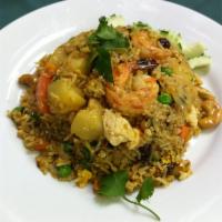 Pineapple Fried Rice · Fried rice with yellow curry powder, pineapple chunk, raisin, tomato, pea, carrot, onion, ca...