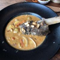 Lion King · Braised short ribs, potatoes, carrots, peanuts and pearl onion in masaman curry sauce. Glute...
