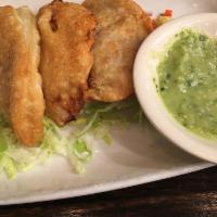 Empanadas · 4 assorted empanadas, chicken and cheese, or beef and cheese. Served with pico de gallo and ...