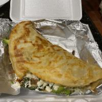 Quezadilla Azteca · Original signature quesadilla. Made with a handmade 12 inch corn tortilla with melted cheese...