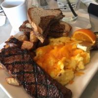 Steak and Eggs · 8oz Strip Steak, Two Eggs Any Style, Choice of Toast, Breakfast Potatoes, Shallot butter, an...